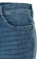 Close-up of blue jeans on a white background