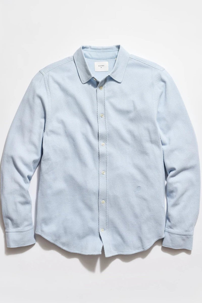 Light blue textured shirt on a white background
