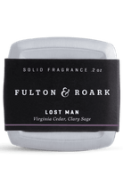 Solid fragrance container with 'Fulton & Roark' label on a white background