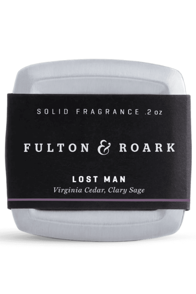 Solid fragrance container with 'Fulton & Roark' label on a white background