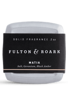 Solid fragrance container with 'Fulton & Roark' label on a white background