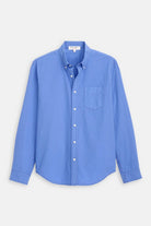 Blue button-up shirt on a light gray background