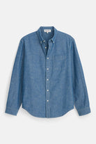 Blue denim shirt on a light gray background