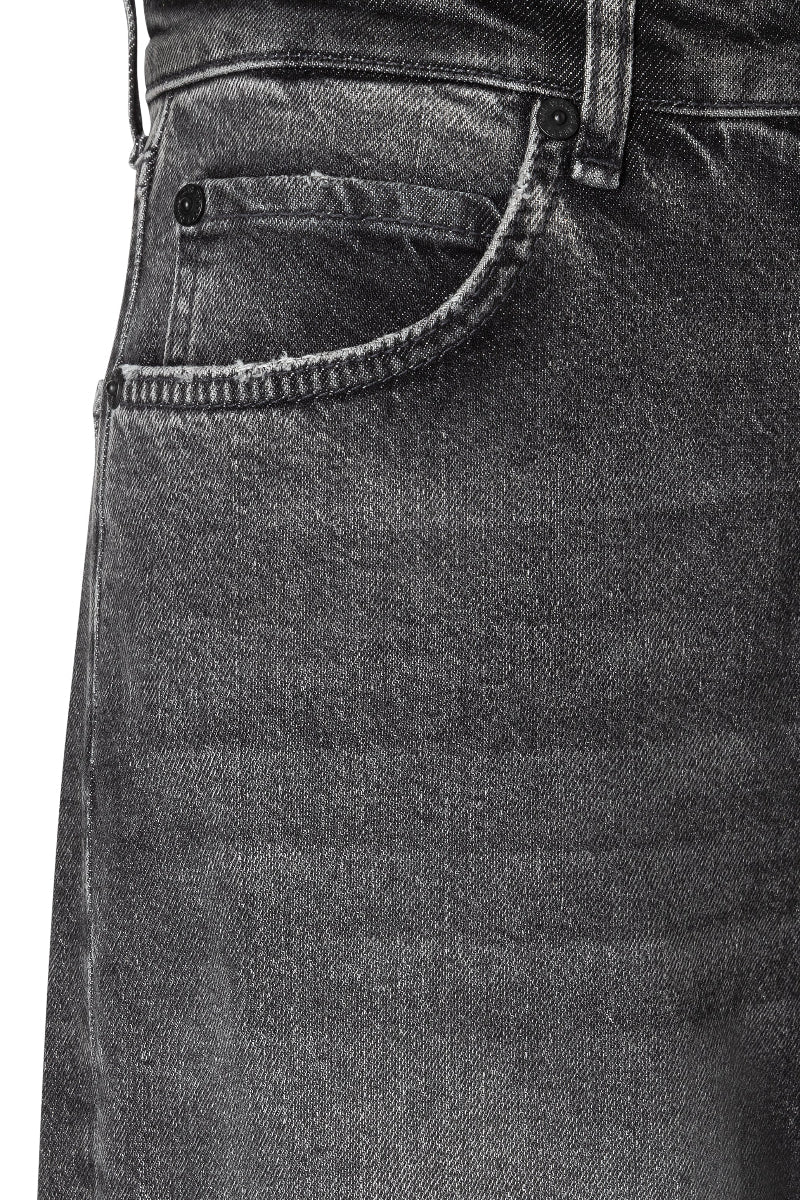 Close-up of dark gray jeans with a focus on the pocket area.