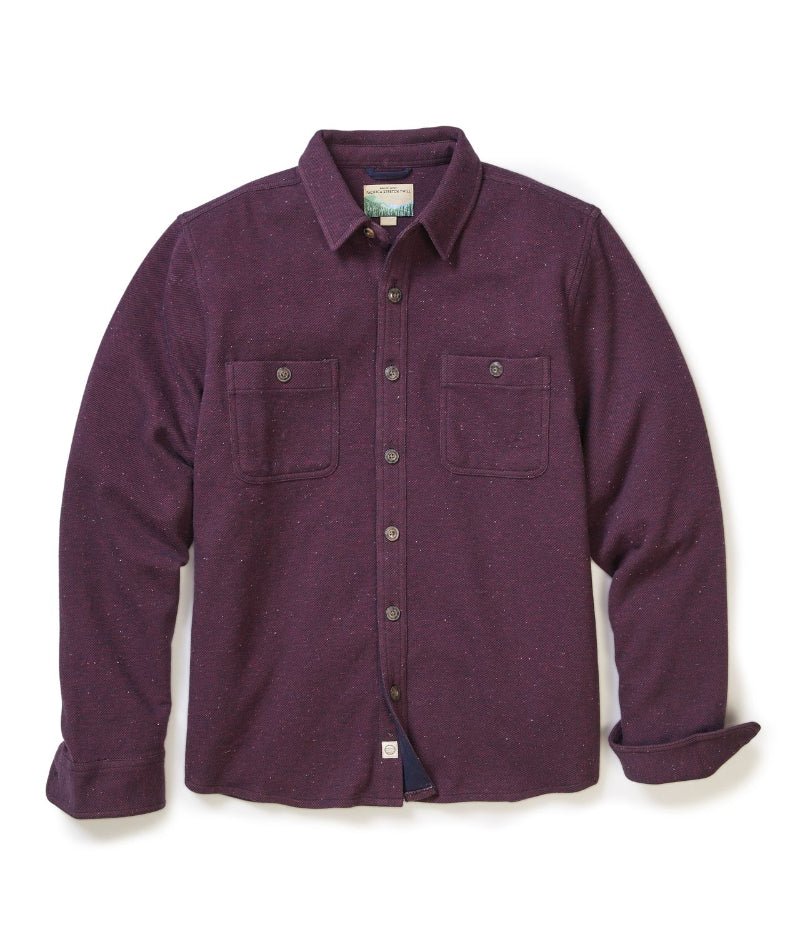 Purple flannel shirt on a white background