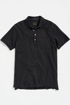 Black polo shirt on a white background