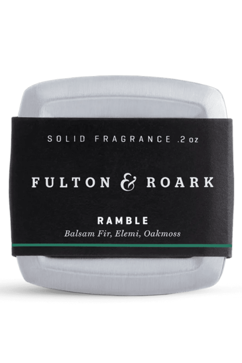 Solid fragrance container with 'Fulton & Roark' label on a white background
