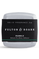 Solid fragrance container with 'Fulton & Roark' label on a white background
