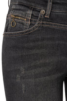 Close-up of dark blue jeans with visible stitching and buttons on a white background