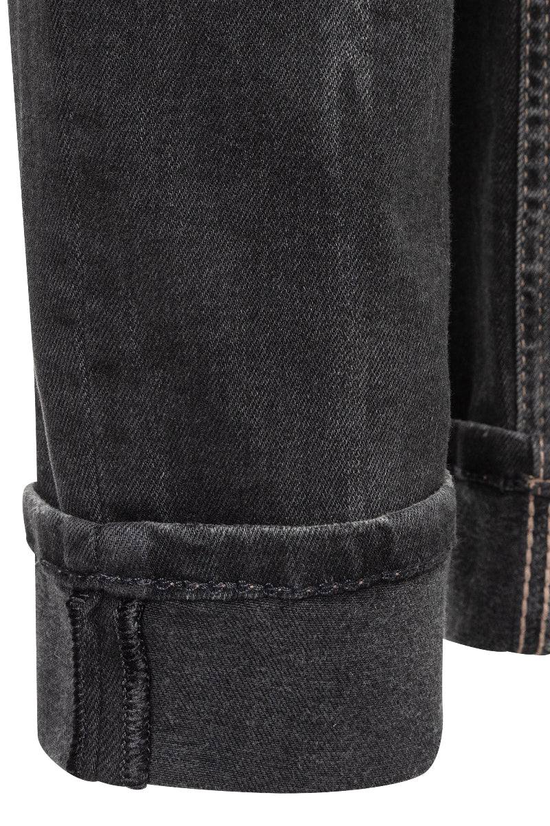 Close-up of black denim jeans with rolled-up hem on a white background