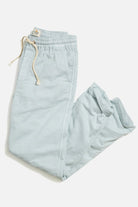 Light blue pants with a drawstring on a white background