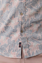 Floral patterned shirt with pink flowers on a gray background