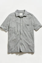 Gray striped short-sleeve shirt on a light gray background