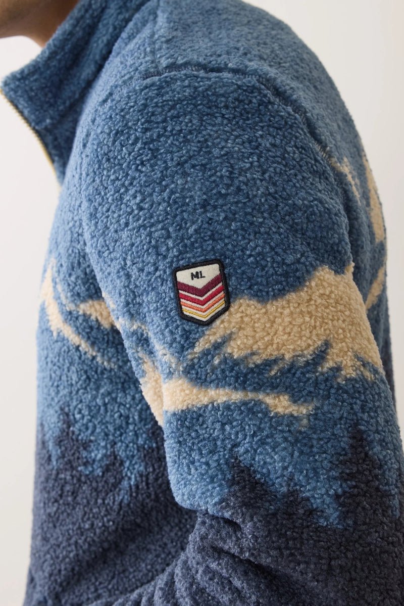 Blue fleece jacket with a brand logo on a white background