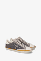 Pair of gray and white sneakers on a white background