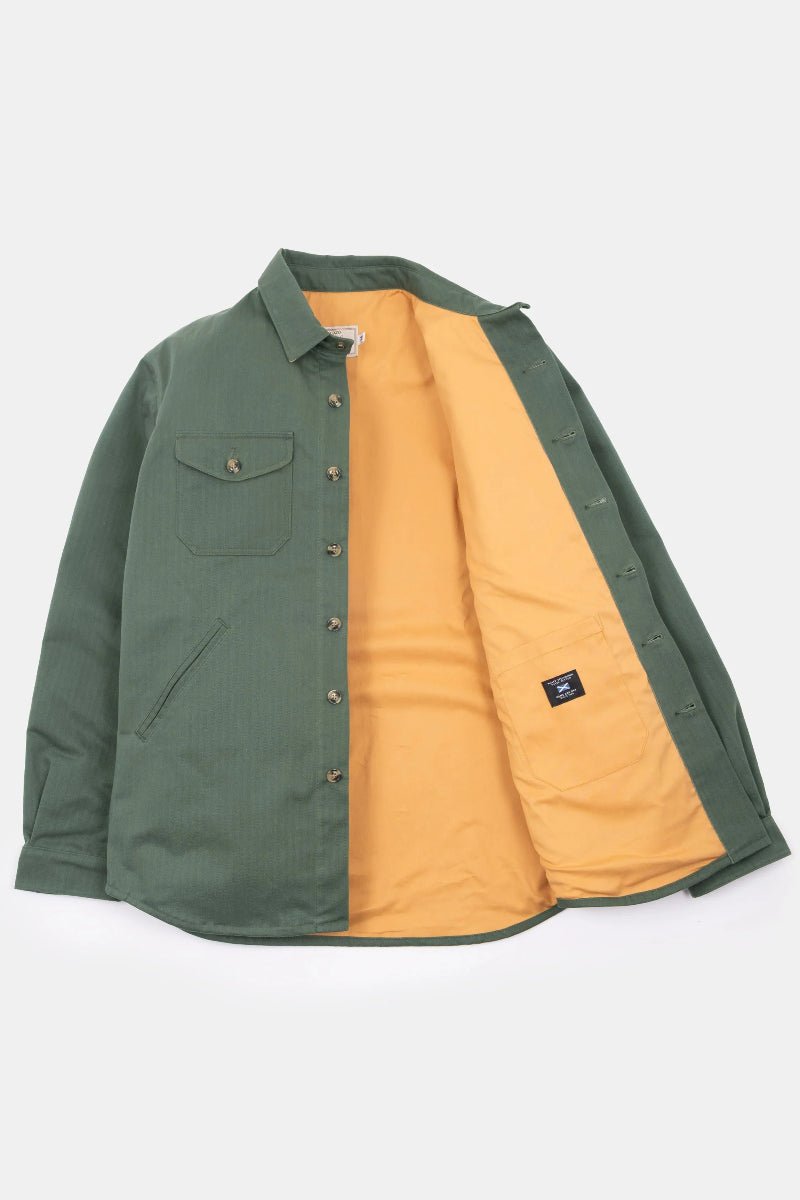Green jacket with orange lining on a white background