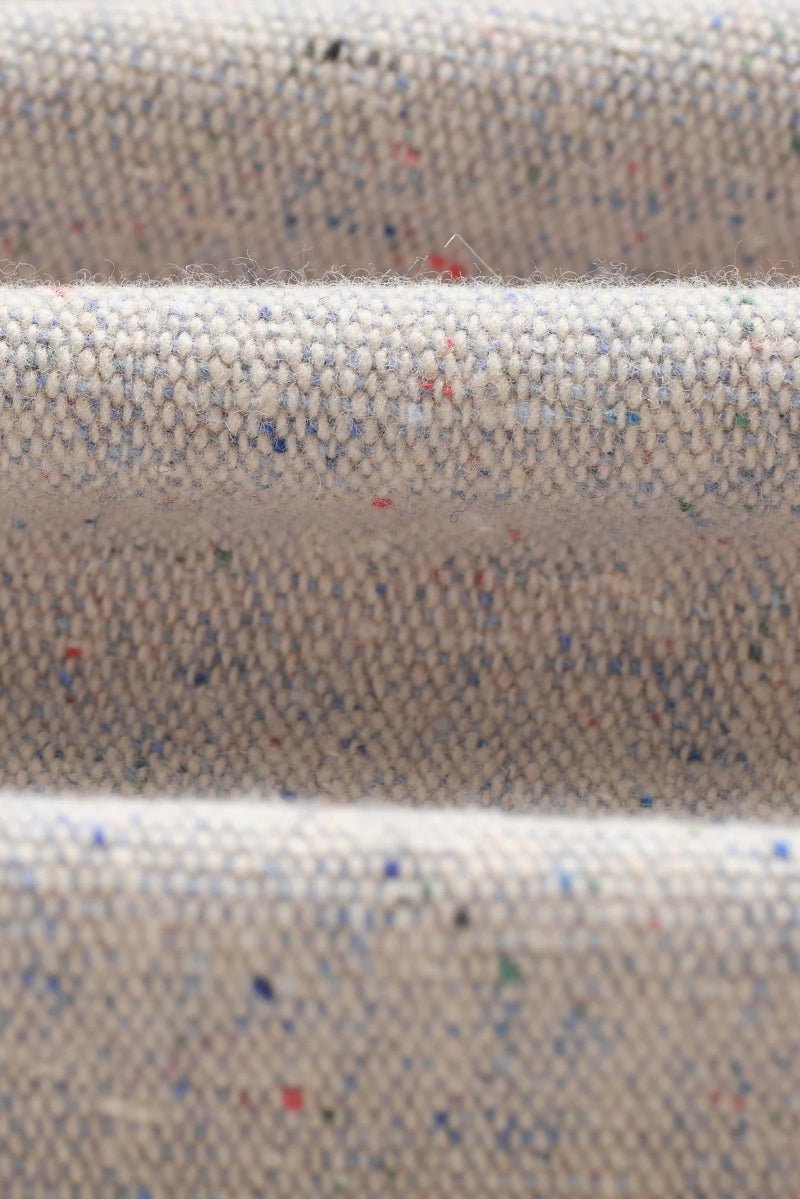 Close-up of textured fabric with speckled pattern