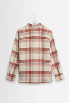 Plaid shirt on a hanger against a white background