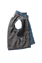 Quilted dog vest with gray and blue pattern on a white background