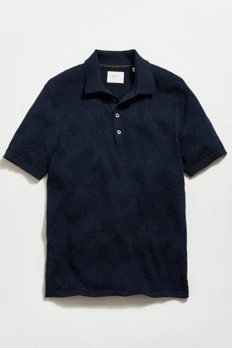 Navy blue textured polo shirt on a light gray background