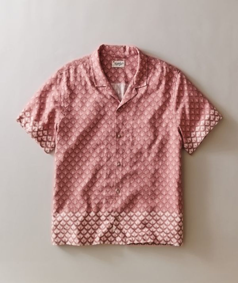 Pink patterned shirt on a light gray background